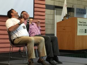 Keynote Speaker Joel Zeff and Bob Mayo, Principal, Exeter Unified High School, during an improve exercise at the 2016 Tulare County Summer Institute. 